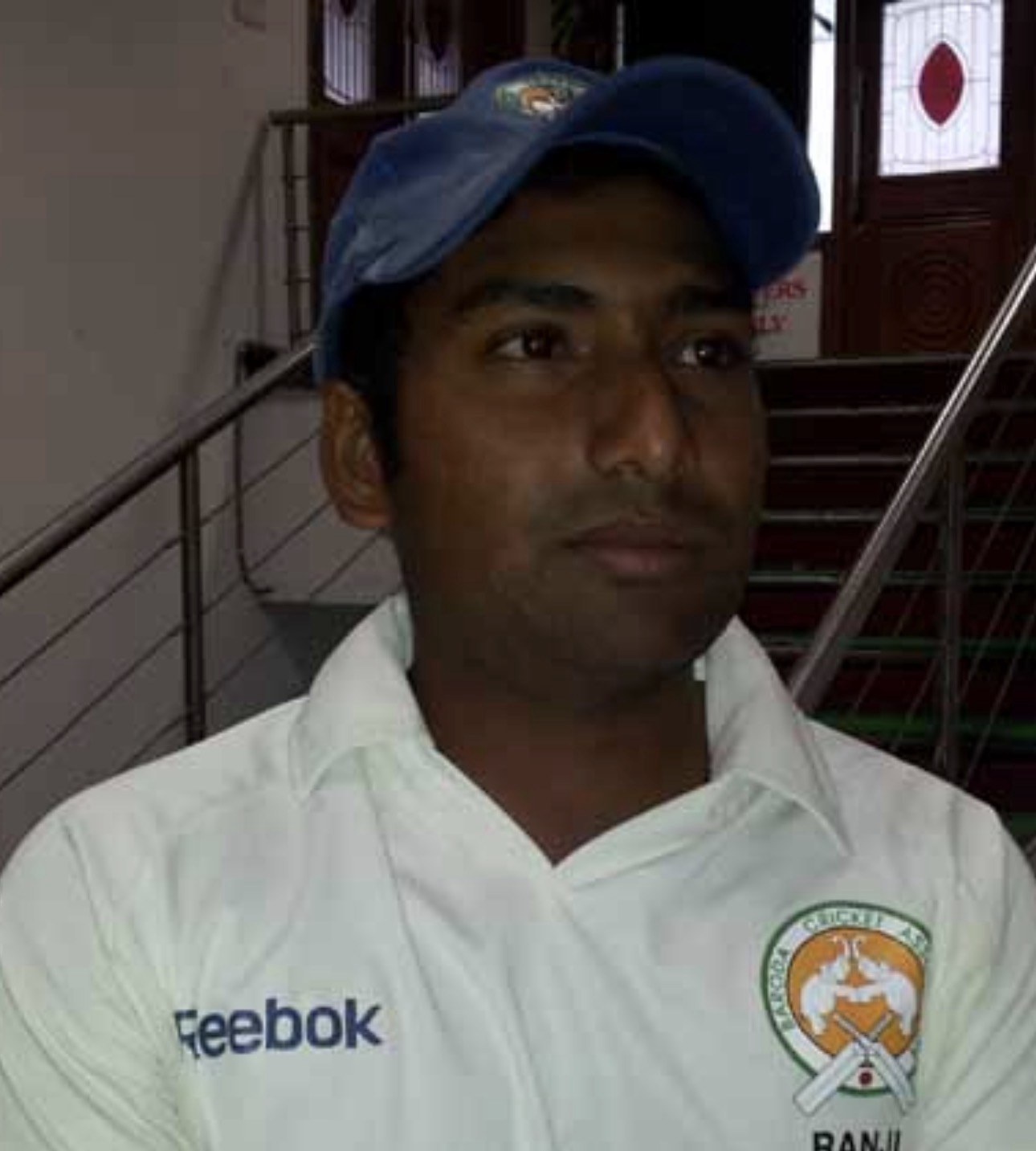 Rakesh Solanki in cricket whites and a Baroda cap